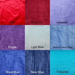 May include: A color chart showing nine different fabric swatches in various shades of red, purple, blue, and turquoise. The swatches are labeled with their corresponding color names: Red, Burgundy, Lavender, Purple, Light Blue, Medium French Blue, Royal Blue, Navy Blue, and Turquoise.