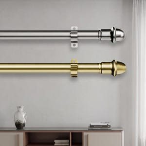 May include: Two horizontal curtain rods, one in a polished silver finish and one in a brushed gold finish. Each rod features a smooth cylindrical shaft, a rounded finial at the end, and a central mounting bracket with two screw holes for installation.