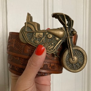 Vintage 1970s solid brass motorcycle belt buckle with brown tooled leather belt