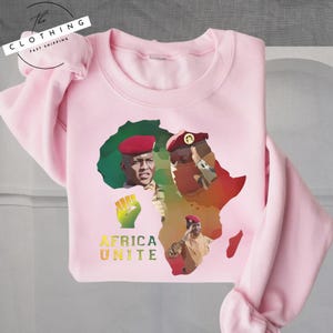 a pink shirt with a picture of a man in africa on it