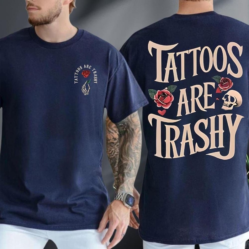 A man wearing a navy blue t-shirt with the text "Tattoos are Trashy" printed on the back.