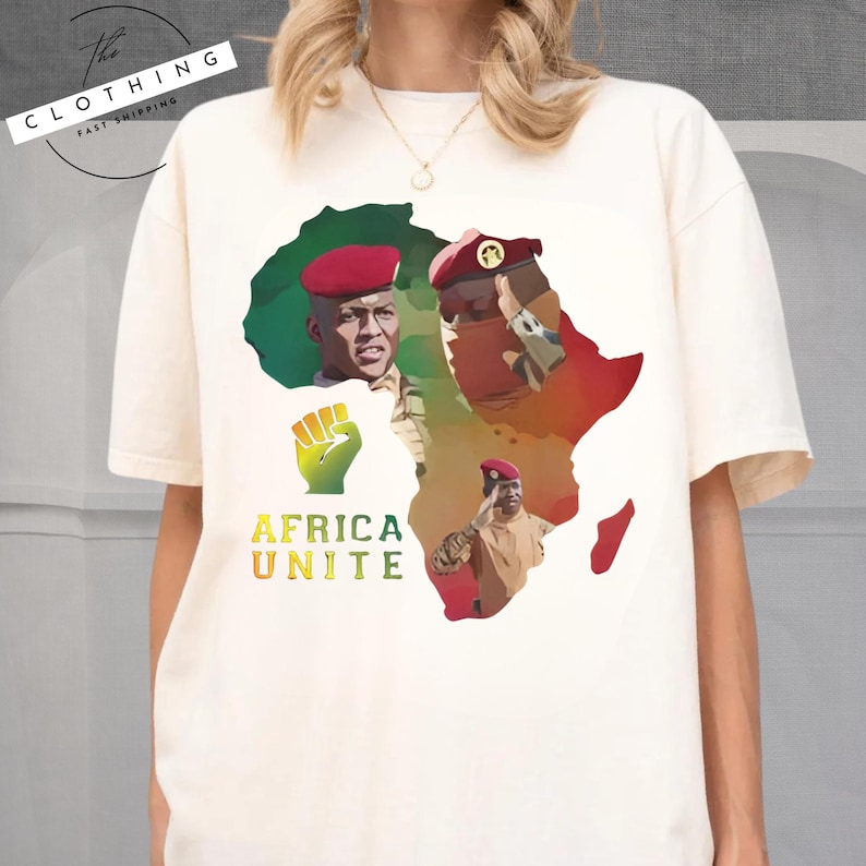 a woman wearing a white t - shirt with a picture of africa on it