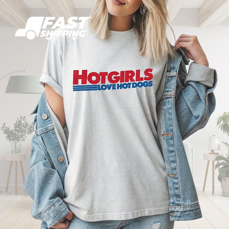 a woman wearing a t - shirt that says hot girls love hot dogs