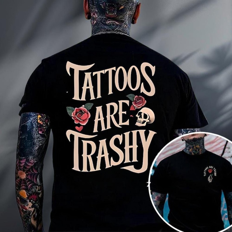 A person wearing a black t-shirt with the text "Tattoos are Trashy" printed on it.