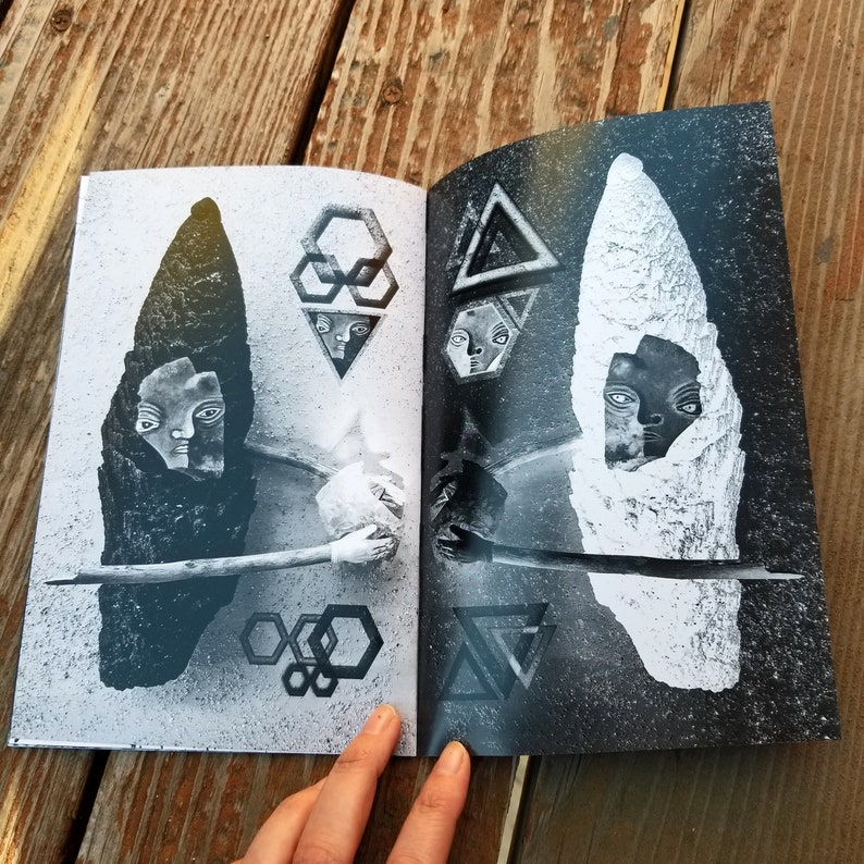 May include: A black and white book with two pages open. The left page features a black and white image of a face with a geometric pattern behind it. The right page features a black and white image of a face with a geometric pattern behind it.