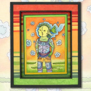 May include: A framed artwork featuring a whimsical illustration of a two-faced figure with green skin, wearing a patterned outfit. The artwork is set against an orange and green background with cloud motifs, framed in black, orange, and green.