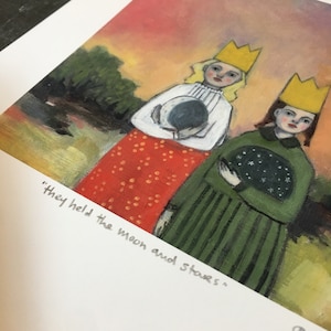 May include: A print featuring two figures wearing yellow crowns, one in a white blouse and red skirt holding a moon, the other in a green dress holding a star-filled sphere. The text "they held the moon and stars" is printed below the illustration.