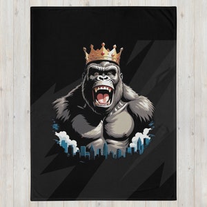 May include: A black and gray gorilla wearing a gold crown with blue jewels. The gorilla is roaring with its mouth open. The gorilla is in front of a cityscape with white clouds.