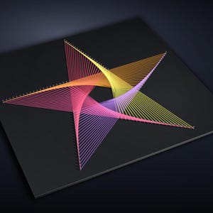 May include: A square black board featuring a geometric star pattern created with taut, vibrant threads in shades of pink, orange, yellow, and purple. The threads are anchored by small pins arranged in a star shape, forming a complex, layered design.
