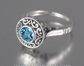 The SECRET DELIGHT silver ring with Swiss Blue Topaz