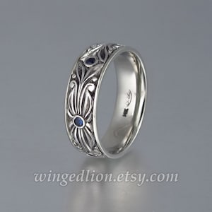 The COUNT mens wedding band in 14K white gold with Blue Sapphires