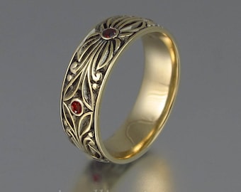 The COUNT mens wedding band in 14K yellow gold with Garnets