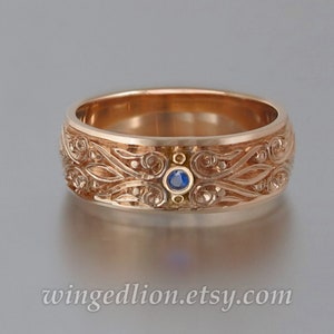 The PRINCE CHARMING 14k gold mens wedding band with Blue Sapphire