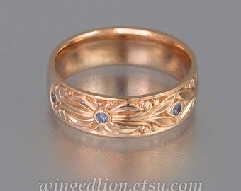 The COUNT mens wedding band in 14K rose gold with alexandrites