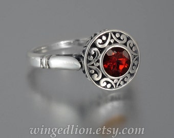 The SECRET DELIGHT silver ring with red Garnet and white sapphires