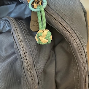 Handgemaakte paracord apenvuist knoop ritssluiting, aangepaste kleur tasbedel