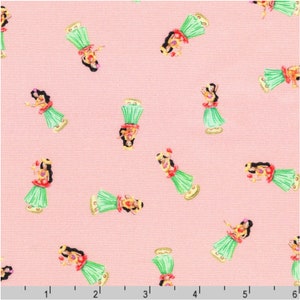 May include: Pink fabric with a repeating pattern of hula dancers wearing green grass skirts and flower leis. The dancers are holding flowers and have dark hair.