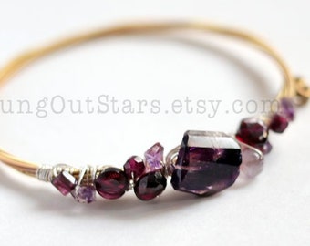 Rapture - Strung-Out guitar string bangle with garnet and moss amethyst