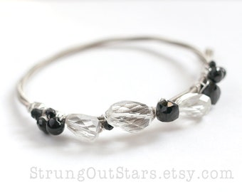 Monochrome - Strung-Out guitar string bangle with rock crystal and black spinel