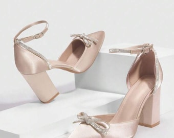 Pinkish-gold heel with front bow