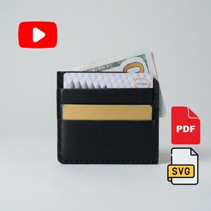 May include: A black leather card holder featuring three horizontal slots containing a gold-colored card, a white patterned card, and a US dollar bill. The item is displayed alongside a red YouTube icon, a red PDF icon, and a white SVG file icon.
