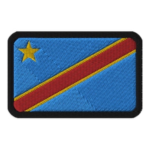May include: A blue and red embroidered patch with a yellow star in the top left corner. The patch has a black border.