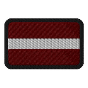 May include: A red and white embroidered patch with the flag of Latvia. The patch has a black border.
