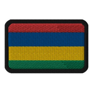 May include: A rectangular embroidered patch with the flag of Mauritius. The flag features four horizontal stripes in red, blue, yellow, and green.