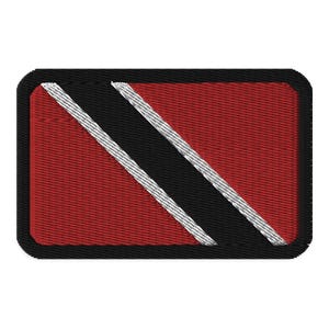 May include: A red, black, and white embroidered patch with the flag of Trinidad and Tobago.