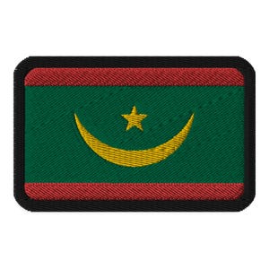 May include: A green, red, and yellow embroidered patch with a crescent moon and star. The patch is surrounded by a black border.
