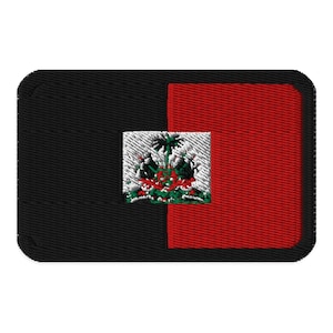May include: Black and red embroidered patch with the flag of Haiti. The flag features a coat of arms with a palm tree and a mountain range.