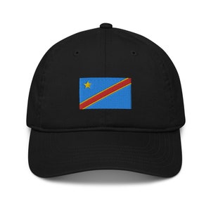 May include: A black baseball cap with an embroidered flag of the Democratic Republic of the Congo. The flag is blue with a diagonal red stripe and a yellow star.