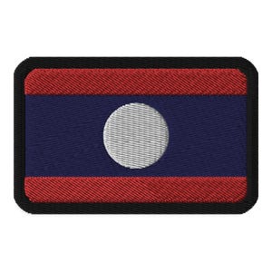 May include: A rectangular embroidered patch with the flag of Laos. The flag is red, blue, and white with a white circle in the center.