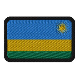 May include: A black-bordered patch with the flag of Rwanda. The flag features three horizontal stripes: light blue, yellow, and green. A yellow sun with 12 rays is in the upper right corner of the blue stripe.