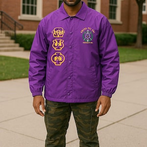 May include: A purple jacket with gold embroidery of Greek letters and the text "Omega Psi Phi Fraternity, Inc."