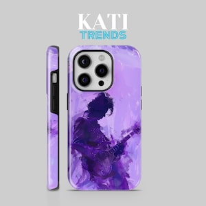 May include: Purple phone case with a silhouette of a person playing a guitar. The case has a watercolor-like design and the text "KATI TRENDS" is at the top.