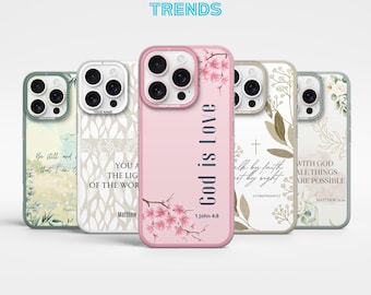 May include: A collection of phone cases with various designs. One case is pink with "God is Love" and floral accents. Other cases feature botanical and inspirational text designs. The brand name "KATI TRENDS" is at the top.