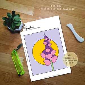 May include: A digital download of a stained glass pattern featuring a foxglove design. The artwork includes a purple and pink flower against a yellow circle, with the text "Foxglove" and "Instant Digital Download". The paper measures approximately 7.8 x 7 inches.