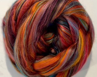 DIA de LOS MUERTOS Día de los Muertos 4 oz Merino/Bamboo Swirlywhirly combed top rich orange base with high-contrast accents