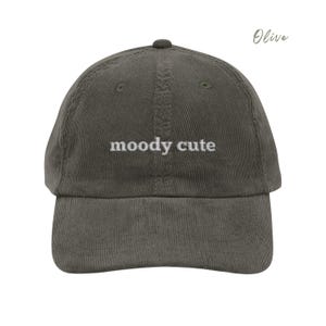 Olive Corduroy Dad Cap with moody cute embroidered in light grey lettering. Unisex style adjustable sizing.