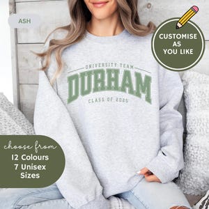 May include: A gray sweatshirt with the text "UNIVERSITY TEAM DURHAM CLASS OF 2025" in green. The sweatshirt is available in 12 colors and 7 sizes.
