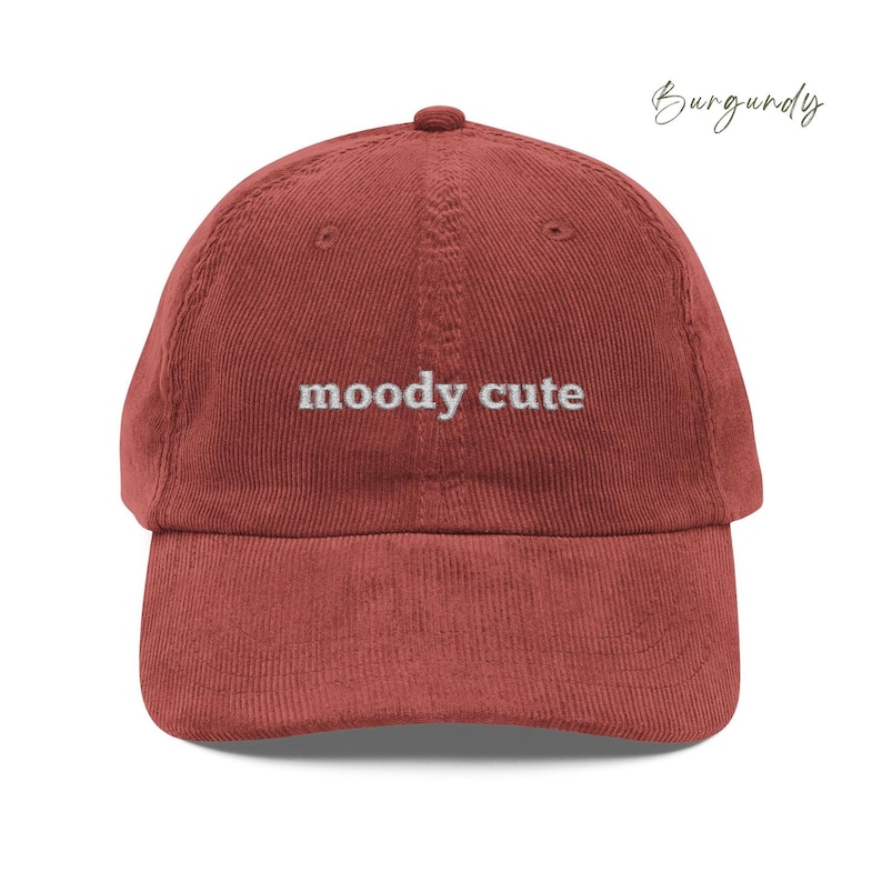 Burgundy Corduroy Dad Cap with moody cute embroidered in light grey lettering. Unisex style adjustable sizing.