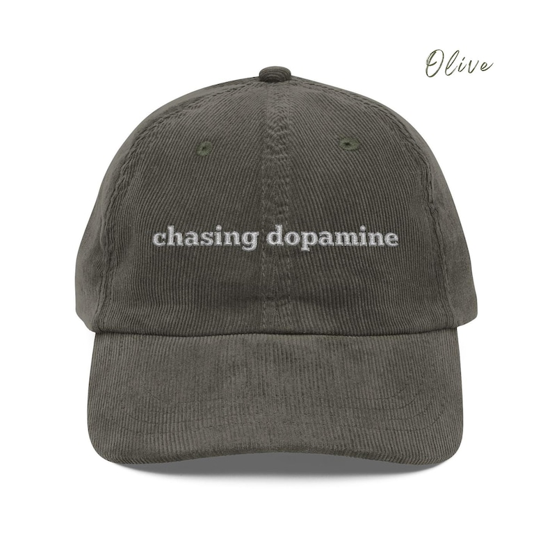 Vintage Corduroy dad hat in olive with embroidered text “chasing dopamine” in light grey thread . A minimalist, mental health inspired design.
