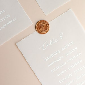 handwritten seating chart card table assignments | hand torn paper - minimalist sustainable wedding - day-of signage - vellum - cream
