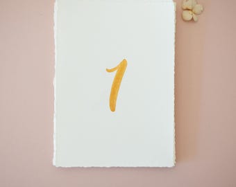 gold painted table numbers | torn edge paper, wedding reception decor