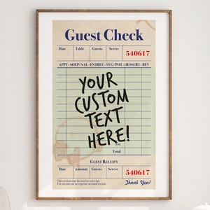 May include: A framed print of a vintage-style guest check. The text "Guest Check" is at the top, with fields for table, guests, and server. The center features the words "YOUR CUSTOM TEXT HERE!" in bold. The bottom reads "Guest Receipt" and "Thank You!"