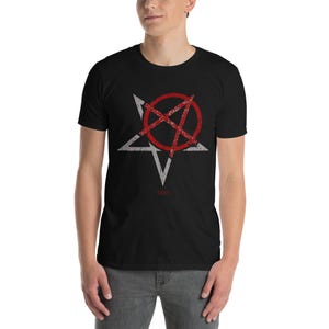 May include: A black t-shirt with a white pentagram and a red circle with a diagonal line through it. The design has a distressed look.
