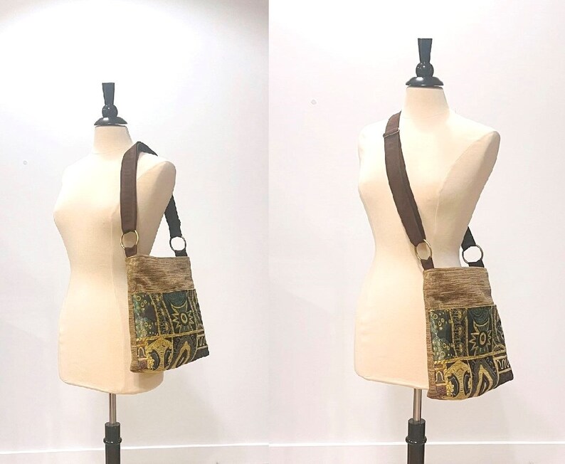 May include: A brown and gold tapestry-style crossbody bag with a brown strap. The bag has a geometric pattern with green, yellow, and brown accents.