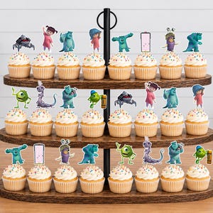 May include: A three-tiered wooden cupcake stand holding twenty-four cupcakes, each topped with a colourful paper cutout of characters from the movie Monsters, Inc. The cupcakes feature white frosting with multicoloured sprinkles in light brown paper liners.
