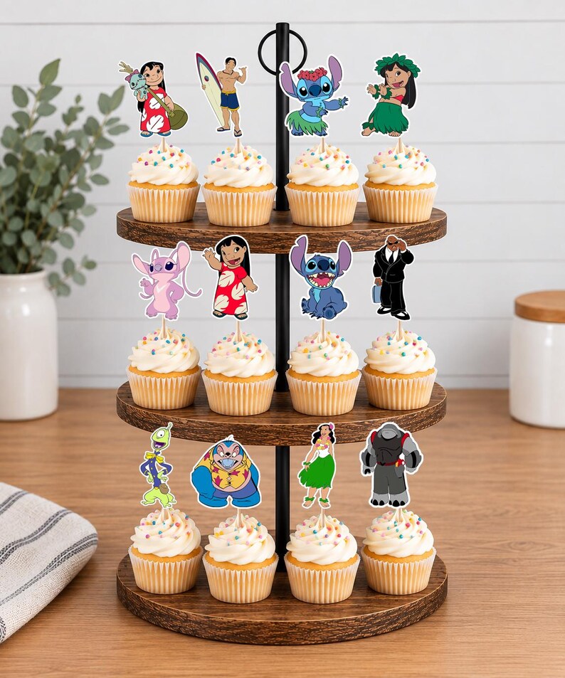 May include: A three-tiered wooden cupcake stand holding twelve cupcakes topped with colorful sprinkles and paper character toppers featuring Lilo, Stitch, and various other animated figures from the Lilo and Stitch franchise on wooden picks.